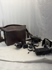 Minolta SRT 201 35mm SLR Film Camera w/ 4 Lenses Extras