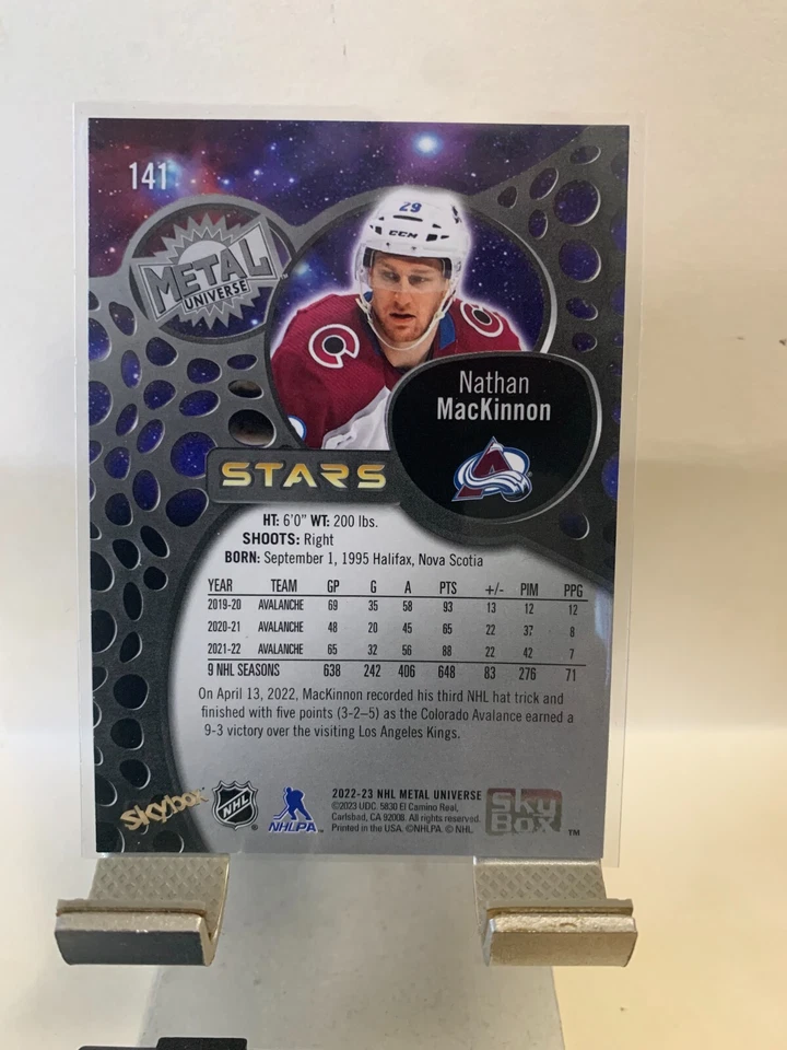 2022-23 Skybox Metal Universe Stars Nathan MacKinnon #141 Colorado Avalanches - Image 2 of 2