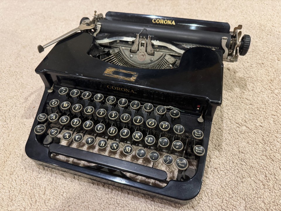 A 1930s LC Smith Corona Standard portable typewriter described as beautiful — a heavy-iron piece of writing history that doubles as striking desk sculpture.