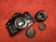 Canon A-1 A1 35mm SLR Film Camera FD 50mm F1.8 Lens Date Back TESTED Working