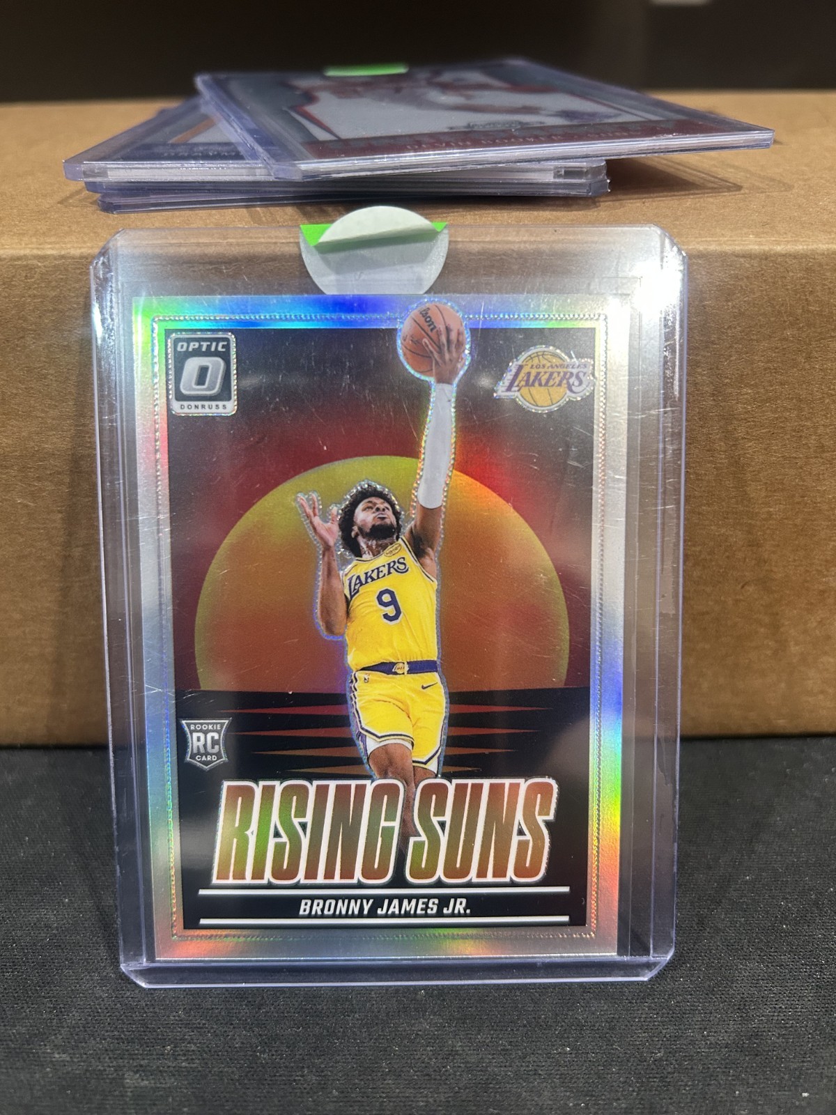 BRONNY JAMES JR 2024-25 DONRUSS OPTIC RISING SUNS ROOKIE HOLO PRIZM RC