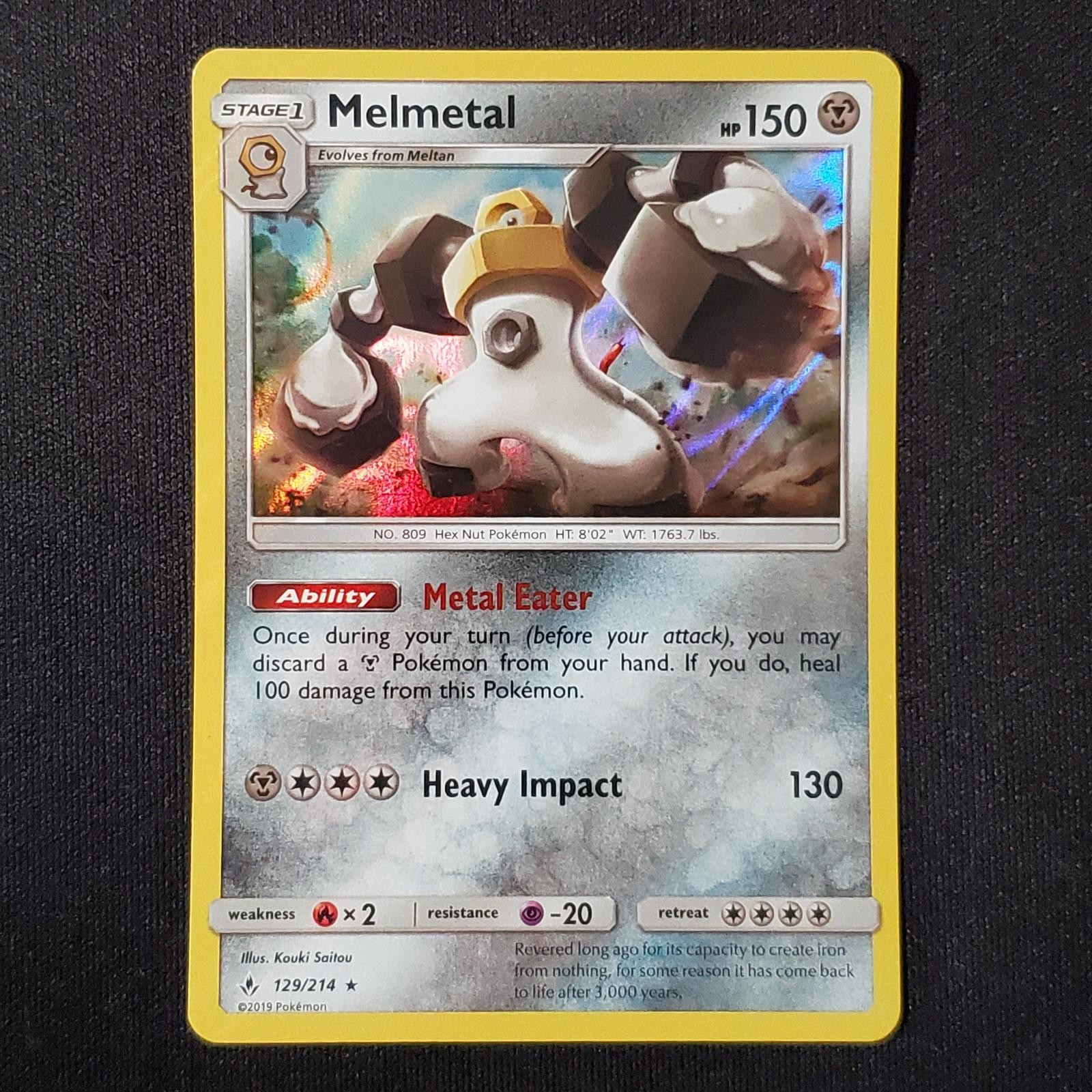 Melmetal 129/214 Holo Rare Unbroken Bonds Pokemon Lightly Played