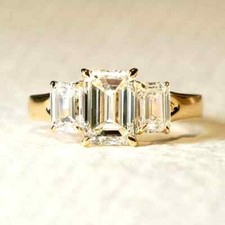 Three Stone 3.50 TCW Emerald Cut Moissanite Engagement Ring In 9ct Yellow Gold