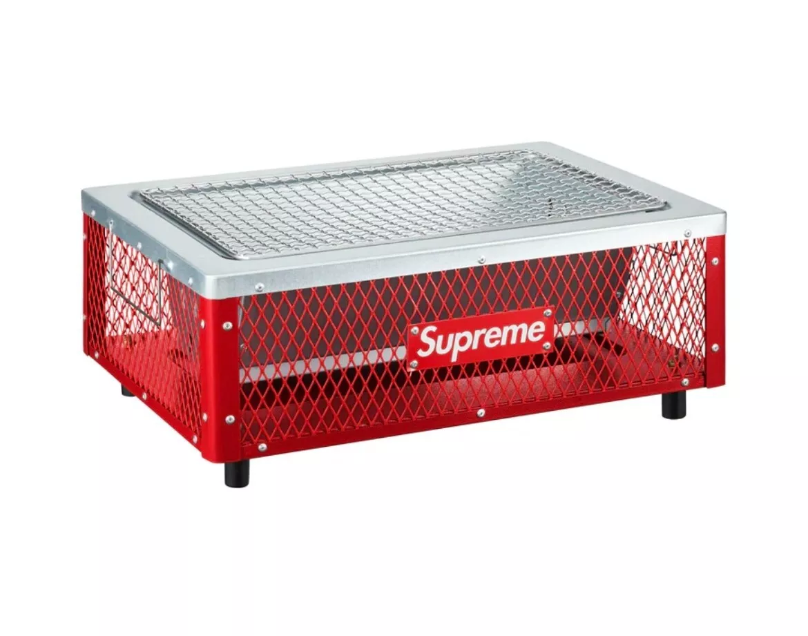 Supreme Coleman Charcoal Grill in Hand