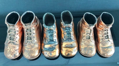 Vintage 1940s Bronze Baby Shoes. All numbered on bottom