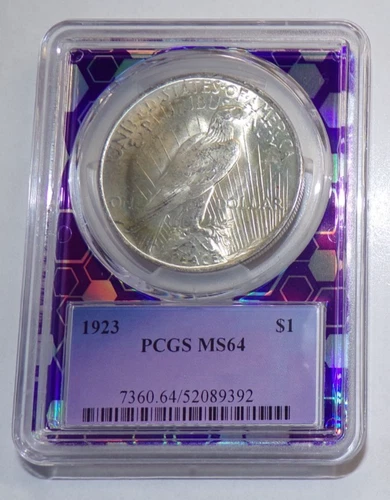 1923 Peace Silver Dollar PCGS MS64 in a purple Bert TraderBea slab