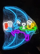 Quarter Moon Neon Sign. Playing Card And Serving Drinks