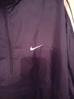 black nike windbreaker with white stripes