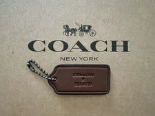 COACH Logo X Peanuts Hang Tag Charm Purse with Chain in Smooth Leather 2'' x 1"