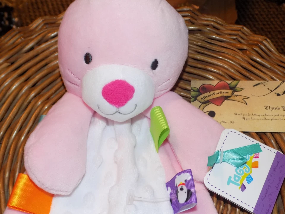 MANTA DE SEGURIDAD TAGGIES CONEJITO CONEJO ROSA COLORIDO FLATSIE MINKY DOT ABDOMEN TAGS Foto 4 de 4