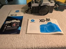 Minolta XG-M 35mm SLR film Camera with Neck Strap & Manuals