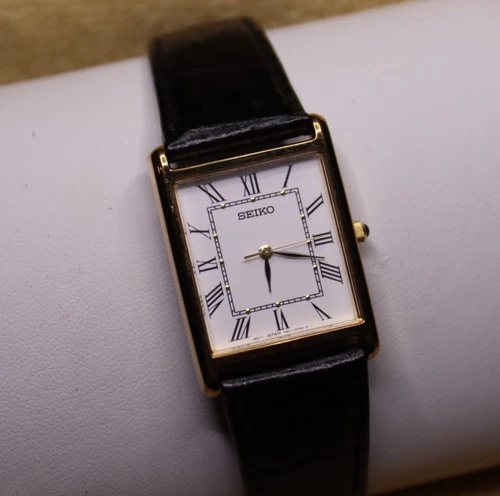 Vtg Seiko Mens 25mm Watch Gold Tone White Tank Roman 7N01-0EZ0 RUNS Orig. Strap