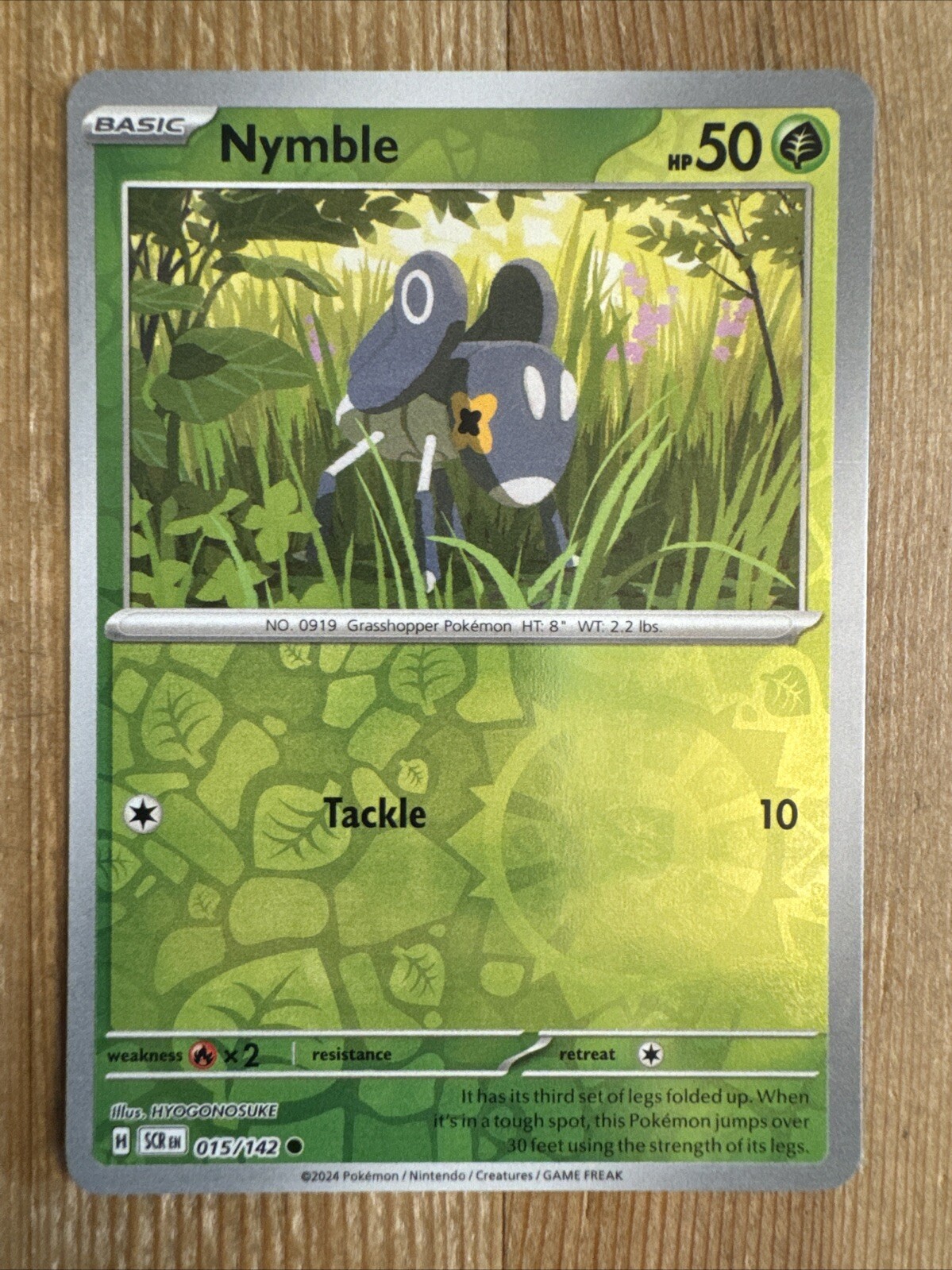 Nymble 015/142 Stellar Crown Reverse Holo Pokemon Card NM