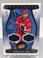 23-24 Sebastian Aho /249 #100 Carolina Hurricanes Jersey UD Artifacts Material