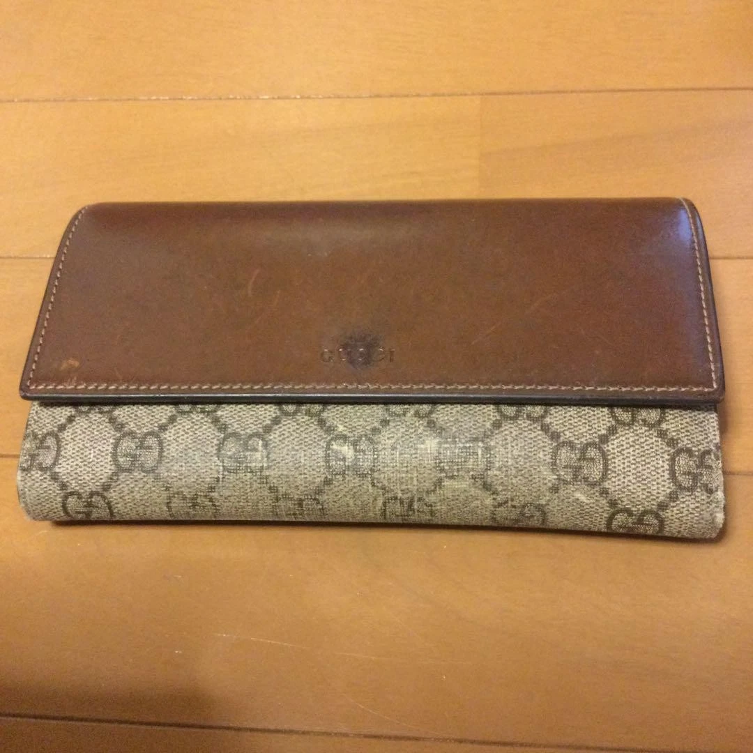 Portefeuille long GUCCI GG Supreme cuir PVC rabat marron 4234