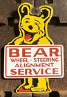 VINTAGE 1955 DATED BEAR WHEEL ALIGNMENT 8” PORCELAIN SIGN GAS OIL SERVICE