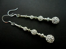 A PAIR OF DANGLY WHITE SHAMBALLA BEAD EARRINGS WITH 925 SOLID SILVER HOOKS. NEW