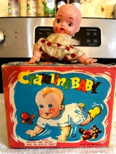 This is a 1950s made in Japan Suzuki Box Toy works suits very dirty colors nice!