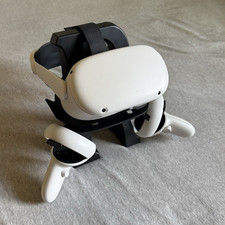 Meta Quest 2 headset with controllers and com...