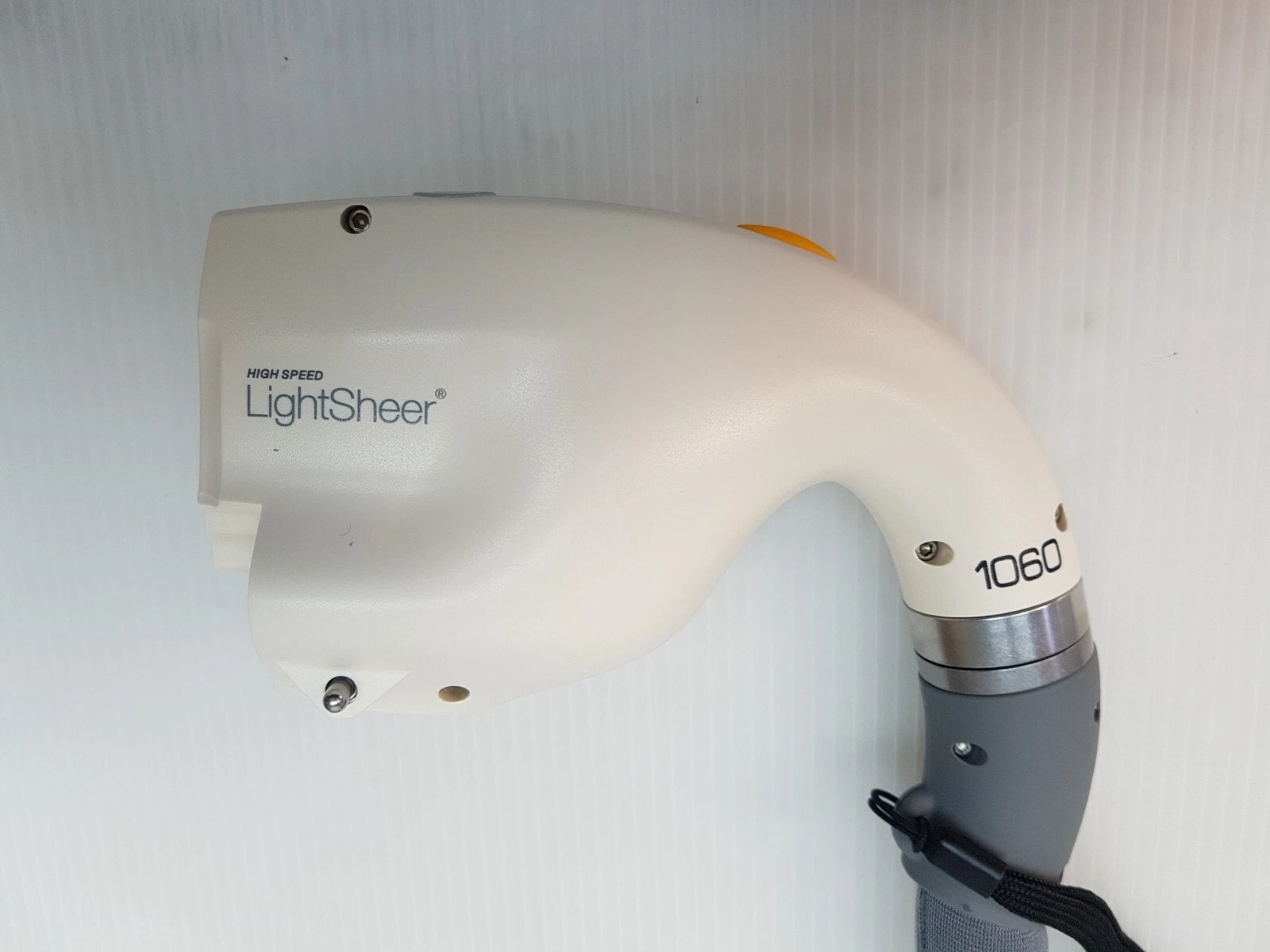 HIGH SPEED LightSheer handpiece head marked 1060, side view