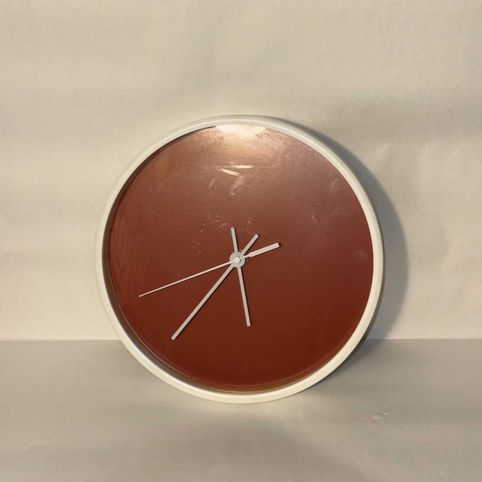Retro wall clock in a cognac brown color