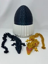 Flexi Dragons, egg, and next -  2 crystal dragons, burnt titanium egg, and nest