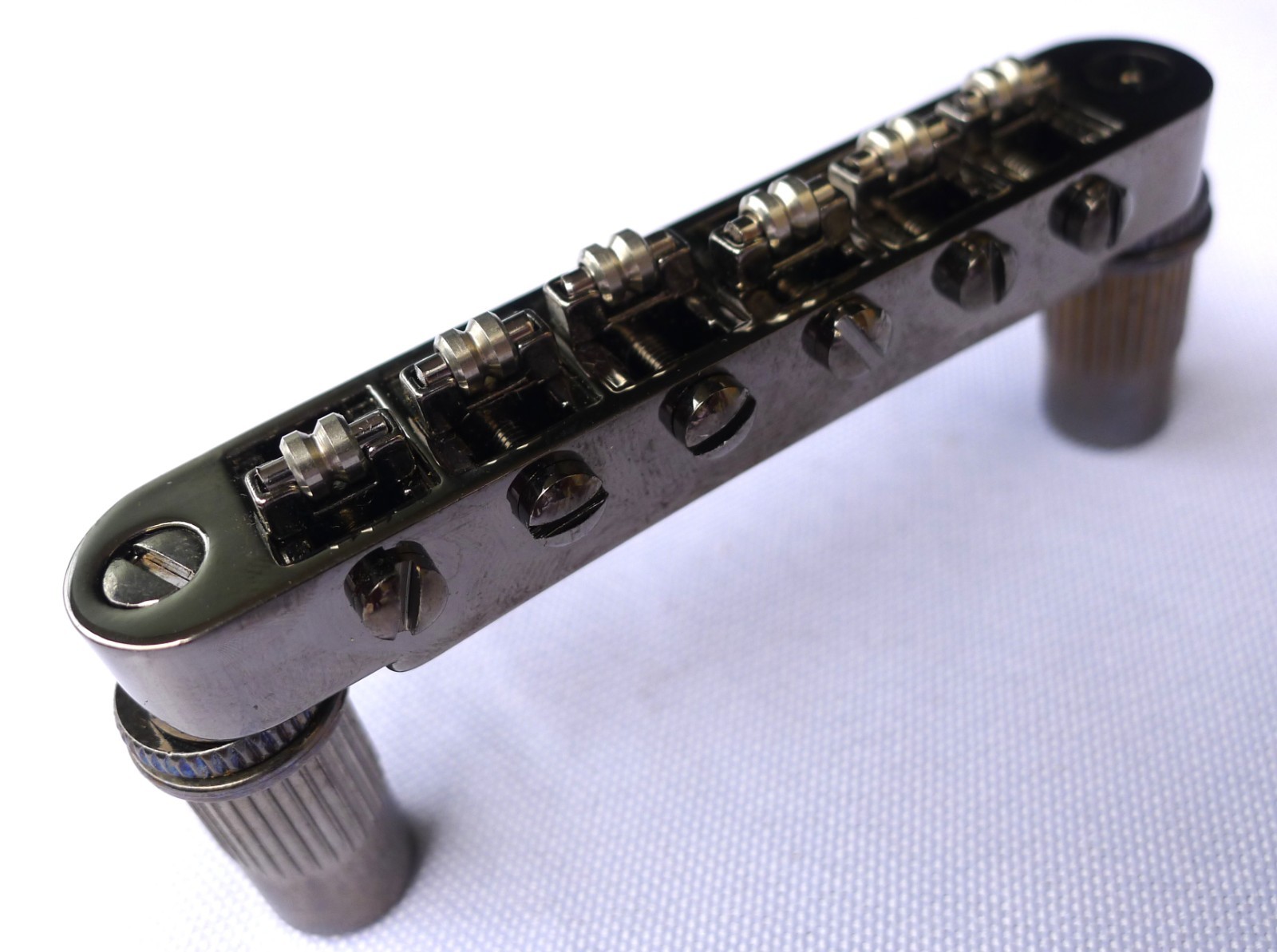 Ponte sella rullo Cosmo nero Tune-O-Matic per chitarre