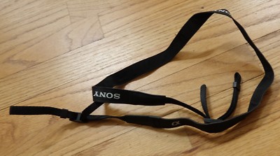 genuine  SONY ALFA  camera black with white logo shoulder strap