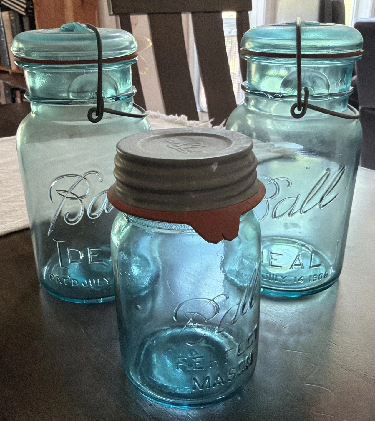 FOUR AQUA BLUE BALL IDEAL QUART JARS, GLASS LIDS, WIRE BAILS-NO. 5, 10