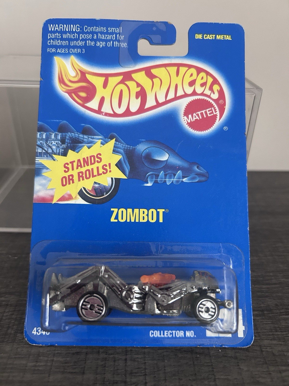 Hot Wheels Blue Card #224 ZOMBOT Dark Chrome w/ Orange Gun New