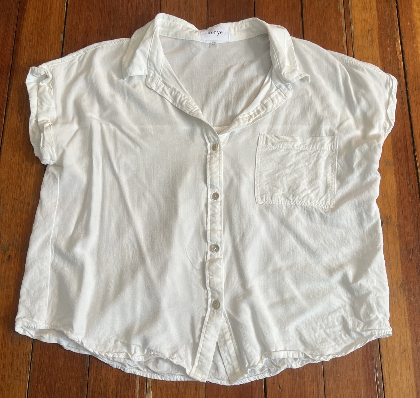 Korye White short sleeve button-down shirt with rolled sleeves and front pocket