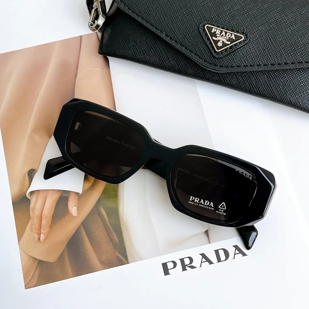 Prada Symbole cat-eye sunglasses with gold-tone logo