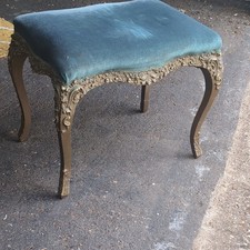Ornate carved wood footstool, green upholstered top, 45x25x35cm