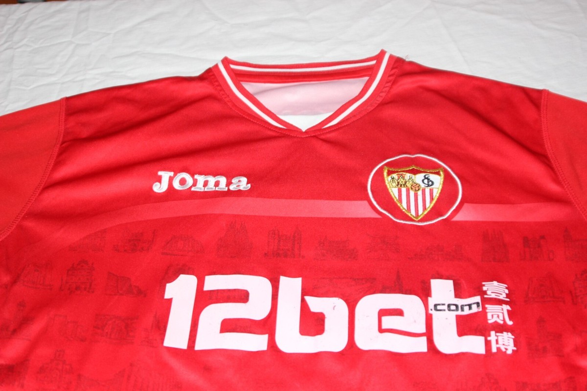 CAMISETA OFICIA SEVILLA FC DE LIGA JOMA T/L  DORSAL Nº 18 F.NAVARRO EUR 139,95 - ES