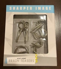 Sharper Image 4pc mind game Brain teasers metal Puzzles keep your mind sharp NIB