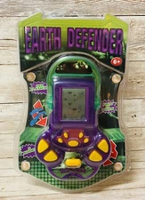 Earth Defender Handheld Electronic Game purple and green, factory sealed