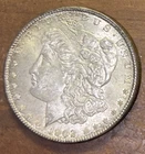 1902-O Morgan Silver Dollar. Circulated lightly toned.
