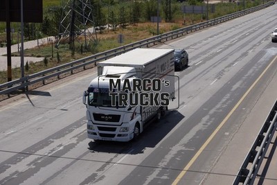 LKW Foto MAN TGX Planensattelzug Kasachstan weiß WOLF #w8hd