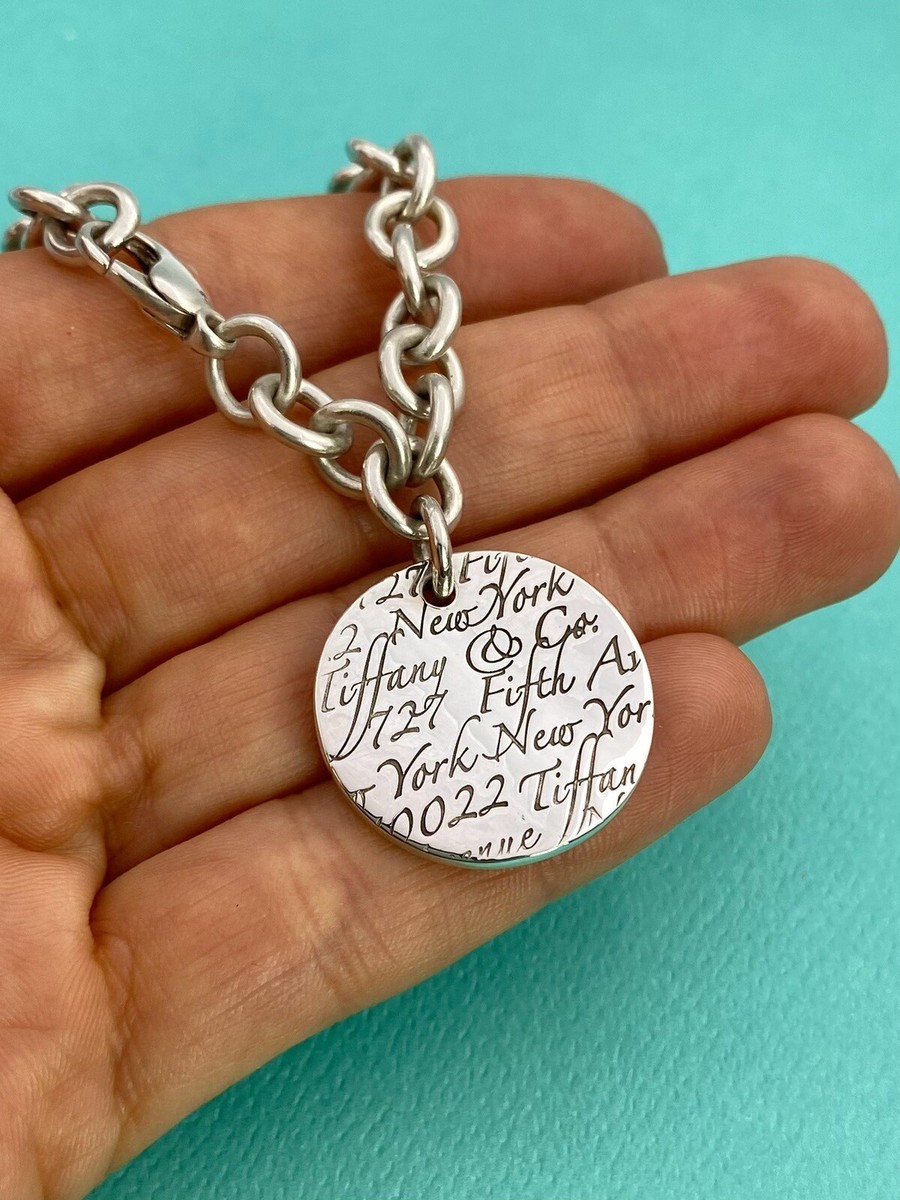 Tiffany & Co Sterling Silver Notes Fifth Avenue Round Tag