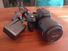 Pentax K-50 (18-135, Hoya UV filter, 2 batteries, 128GB SD)