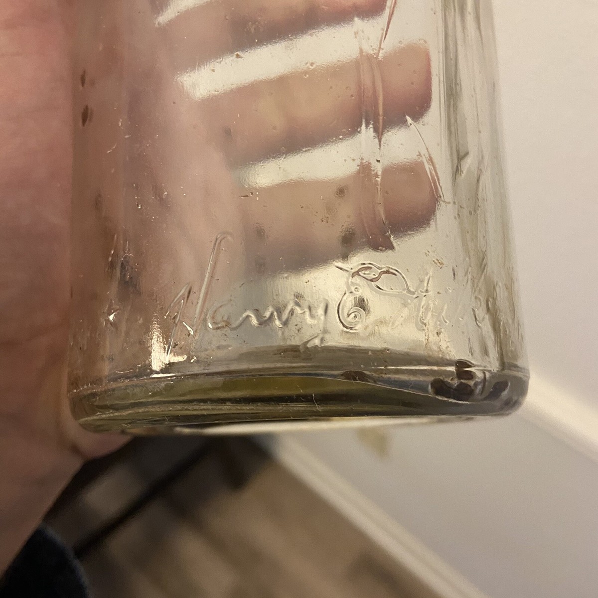 Harry E. Wilken, Jr. Antique Clear Glass Whiskey/Liquor Bottle
