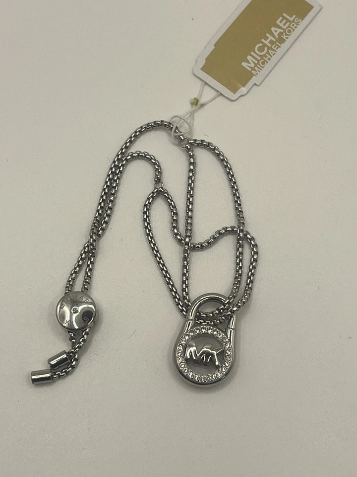 Pulsera Deslizante MICHAEL KORS NUEVA CON ETIQUETAS Tono Plata Cristal Pavé CANDADOS Foto 3 de 4