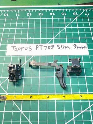Taurus pt 709 slim 9mm. Trigger, trigger bar, extractor. locking insert,