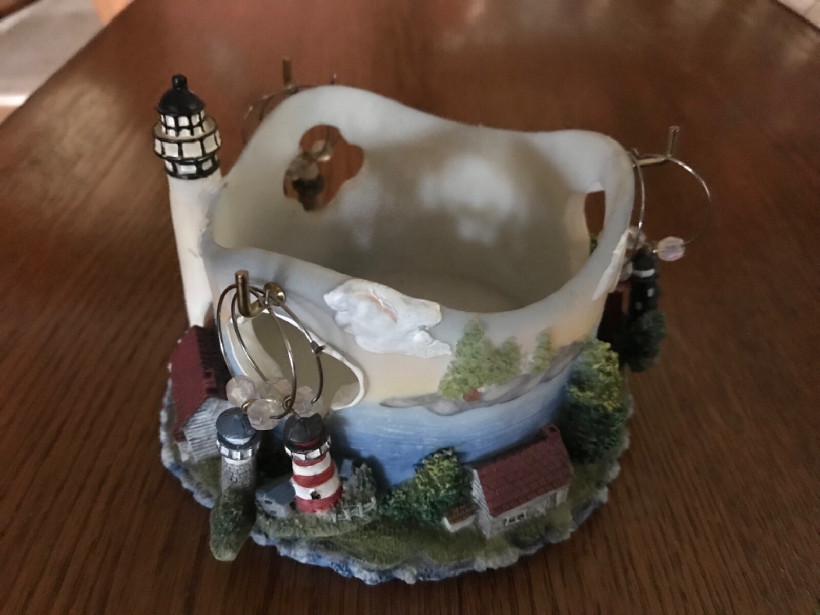 A Richesca Corporation Resin Wine Caddy Holder w/6 Charms MC197