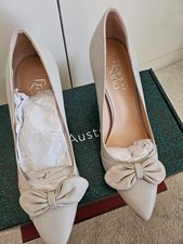 womens  Italian     leather heeled shoes, lovely bow design on front, never worn