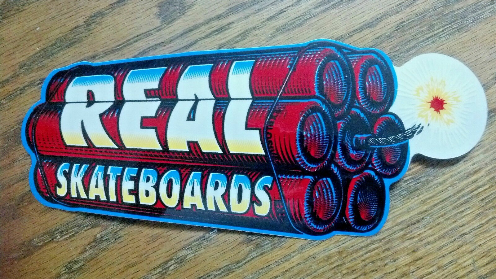 SKATEBOARD STICKER, COLLECTOR, REAL SKATEBOARDS, "THE BOMB", 8" X 3-1/2" 