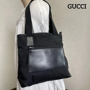 GUCCI Sac fourre tout bandoulière nylon x cuir noir femme i11310