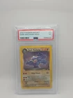 PSA 7 2000 Pokemon Rocket Dark Machamp Holo 1st Edition 10/82 Rare