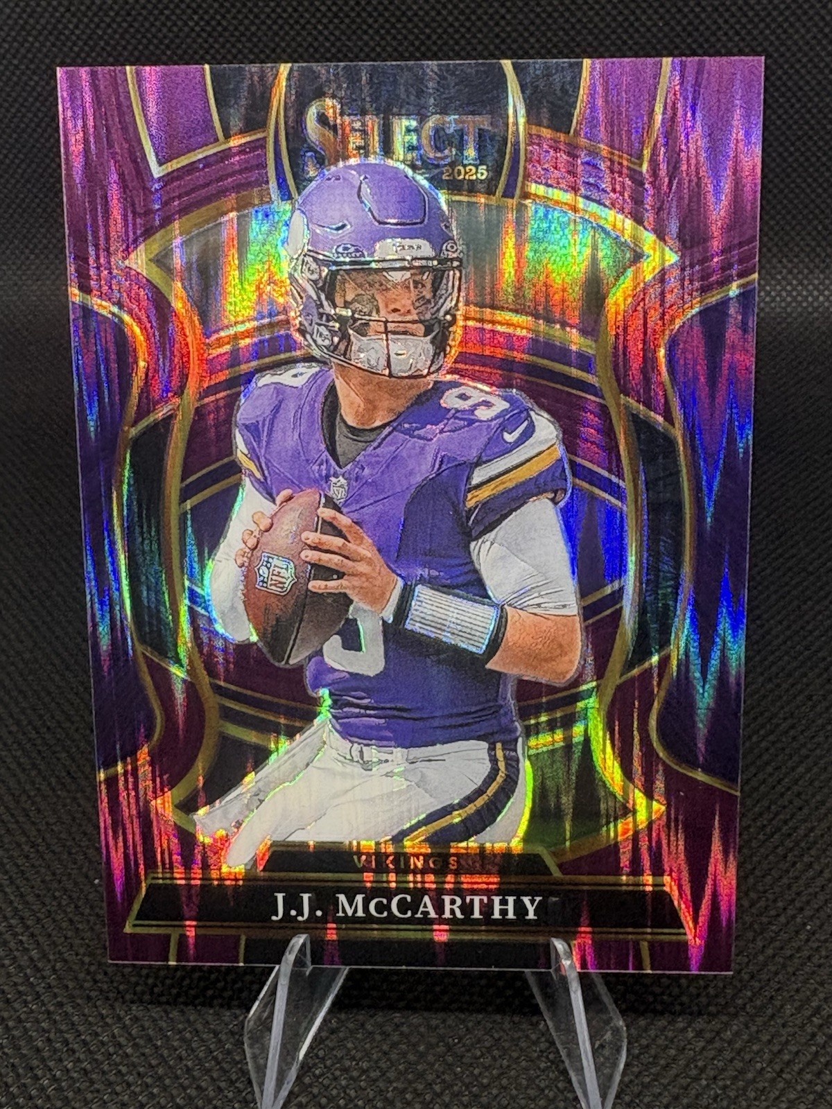 2025 Panini Select - Concourse J.J. McCarthy #63 Purple Shock Prizm 350/699