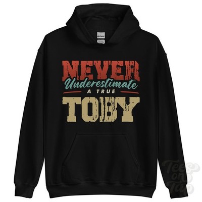 NEVER UNDERESTIMATE A TRUE TOBY HOODIE - Wear Your Name Proudly